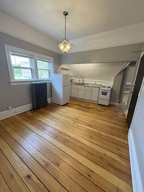Duluth apartment for rent - A kitchen with wooden floors and a window.