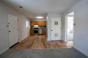 Annapolis apartment for rent - A kitchen area with wooden floors and white walls.