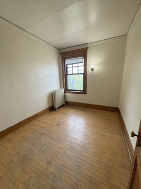 Duluth apartment for rent - A room with wooden floors and a window.