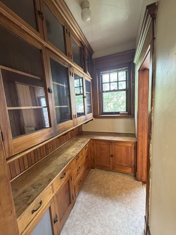 Duluth apartment for rent - A kitchen with wooden cabinets and a window.