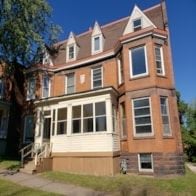 Duluth apartment for rent - A brown house with a white window.