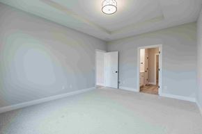 New Richmond house for rent - an empty living room with white walls and a door to a hallway