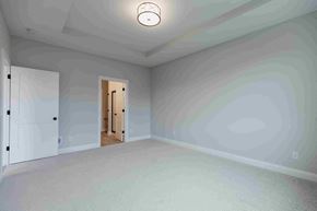 New Richmond house for rent - an empty living room with white walls and a ceiling light
