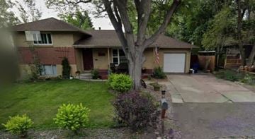 Lakewood house for rent - a young boy standing in front of a house