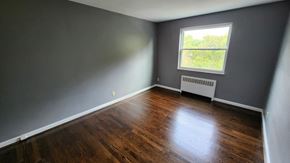 Cincinnati apartment for rent - the living room of a house with wooden floors and a window