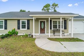 Hubert house for rent - a renovated home with a front porch and a walkway