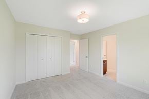 Blaine house for rent - a bedroom with a closet and a door to a hallway