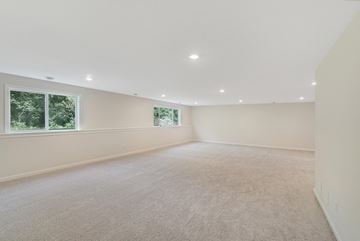 Blaine house for rent - a spacious living room with carpet and a window
