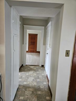 Warren apartment for rent - a bedroom with a bed and a hallway with a door open