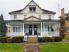 Warren apartment for rent - a white house with a porch and a lawn