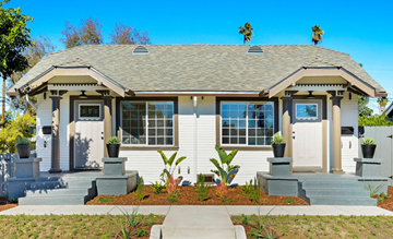 Los Angeles apartment for rent - A house with a grey roof and white walls with a small front porch.