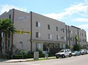 Los Angeles apartment for rent - a large building with cars parked in front of it
