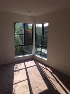 Los Angeles apartment for rent - an empty living room with windows and a balcony