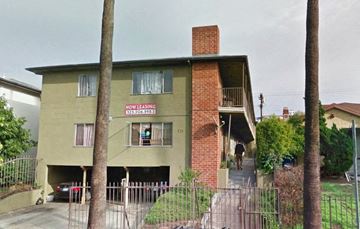 Los Angeles apartment for rent - an old building with a sign on the side of it