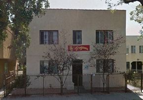 Los Angeles apartment for rent - a white building with a sign on the side of it