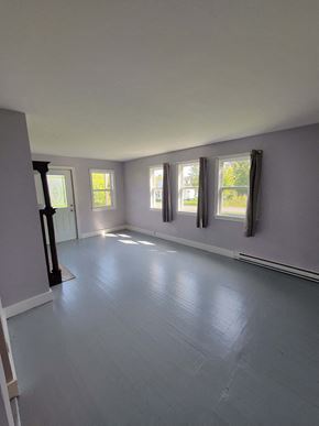 New Glasgow apartment for rent - an empty living room with grey walls and windows