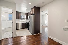 Neptune apartment for rent - a renovated kitchen with a stainless steel refrigerator