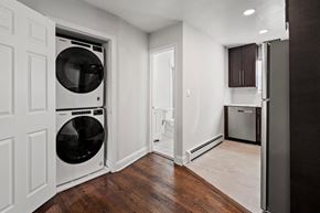 Neptune apartment for rent - a small laundry room with a washer and dryer in it