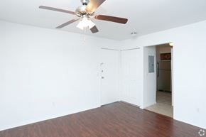 Eatontown apartment for rent - an empty living room with a ceiling fan