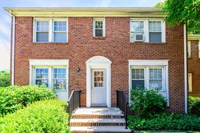 Clifton apartment for rent - the front of a brick house with a white door