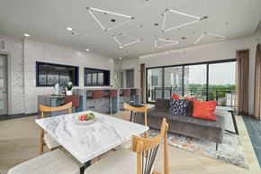 Nashville apartment for rent - A modern dining room with a marble table and chairs.