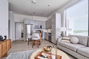 Nashville apartment for rent - A modern kitchen with a dining table and chairs.