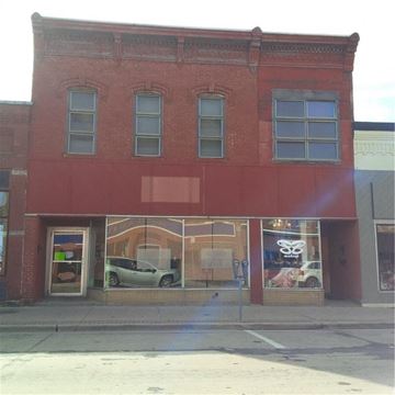 Menomonie apartment for rent - a red building with a car in the window