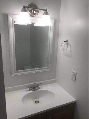 Washington apartment for rent - a bathroom with a sink and a mirror