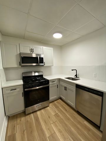 Louisville apartment for rent - A kitchen with a stove, oven, and microwave.