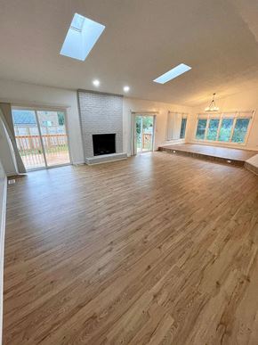 Louisville house for rent - a living room with a fireplace and a wooden floor
