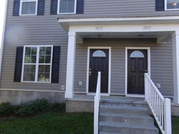 Tallahassee apartment for rent - a house with a front porch and two doors