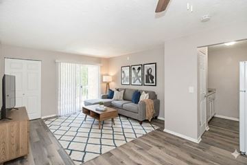 Cincinnati apartment for rent - A living room with a grey couch and a coffee table.