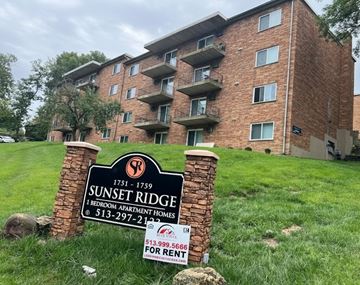 Cincinnati apartment for rent - A sign for Sunset Ridge apartment complex with a price for rent.