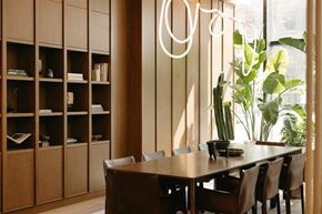 Dallas apartment for rent - a dining room with a wooden table and chairs and a large window