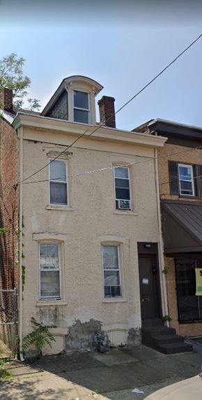 Chester apartment for rent - A white house with a black door and a window with a black frame.