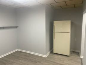 Chester apartment for rent - A white fridge in a room with grey walls.