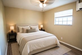 Knoxville apartment for rent - A bedroom with a large bed and a window.