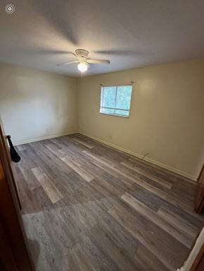 Knoxville apartment for rent - A room with wooden flooring and a window.