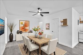 Miami apartment for rent - A dining room with a wooden table and chairs.