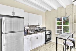 Miami apartment for rent - the kitchen has stainless steel appliances and white cabinets