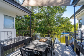 Miami apartment for rent - a dining area with a table and chairs on a balcony