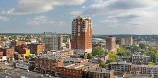 Manchester apartment for rent - an aerial view of a city with tall buildings