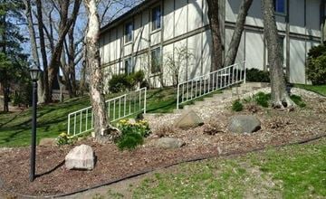 Middleton apartment for rent - a building with stairs and trees in front of it