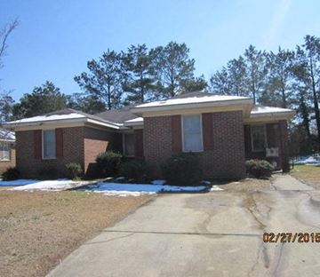 Wilson apartment for rent - a brick house with a sidewalk in front of it