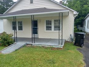 Stantonsburg house for rent - A small house with a porch and a trash can in front.