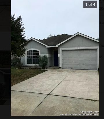 San Antonio house for rent - A house with a grey roof and a white garage door.
