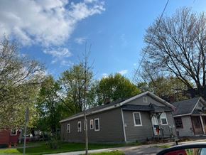 Syracuse apartment for rent - a gray house on the corner of a street