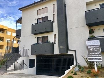 Van Nuys apartment for rent - a building with a sign in front of it
