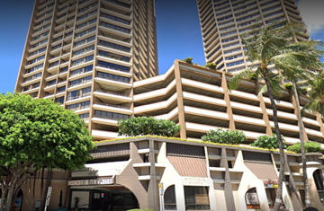 Honolulu apartment for rent - A tall building with a sign that says "Marriott Renaissance".