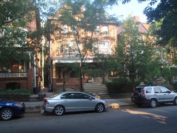 Philadelphia apartment for rent - A silver car is parked on the side of the street.